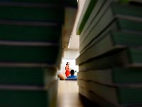 1009397793 ma nb HayMacFistDay  Fourth grade teacher Jane Thomas is seen between the stack of math books she will be handing out on the first day of school at the Hayden McFadden Elementary School in New Bedford.  PETER PEREIRA/THE STANDARD-TIMES/SCMG : education, school, students